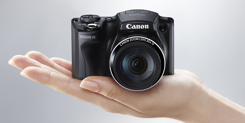 canon powershot sx500 is photo of camera in hand